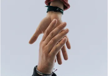 Two hands joined together, illustrating connection and collaboration